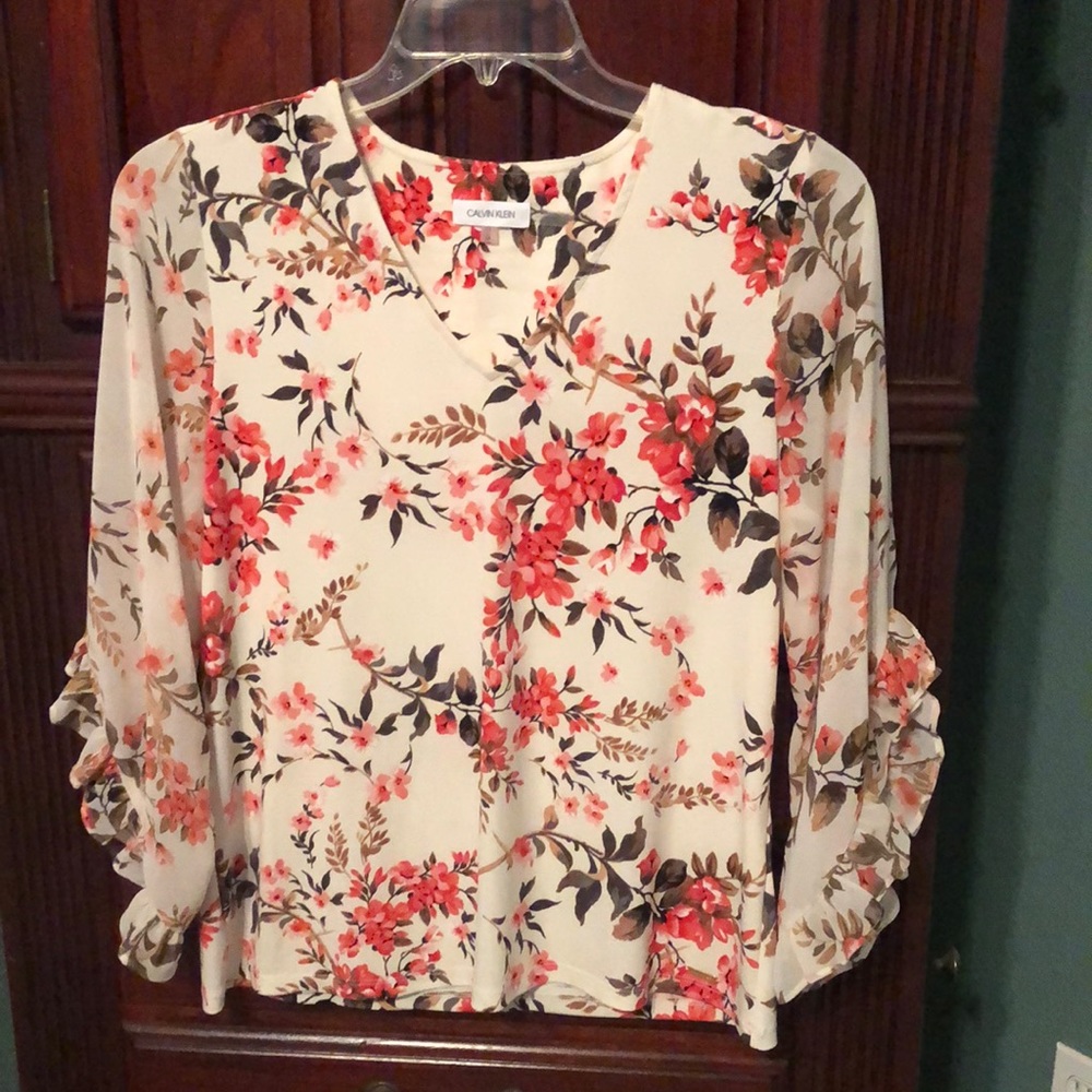 Calvin Klein floral blouse. Bodice is stretchy with sheer/ruffled sleeves